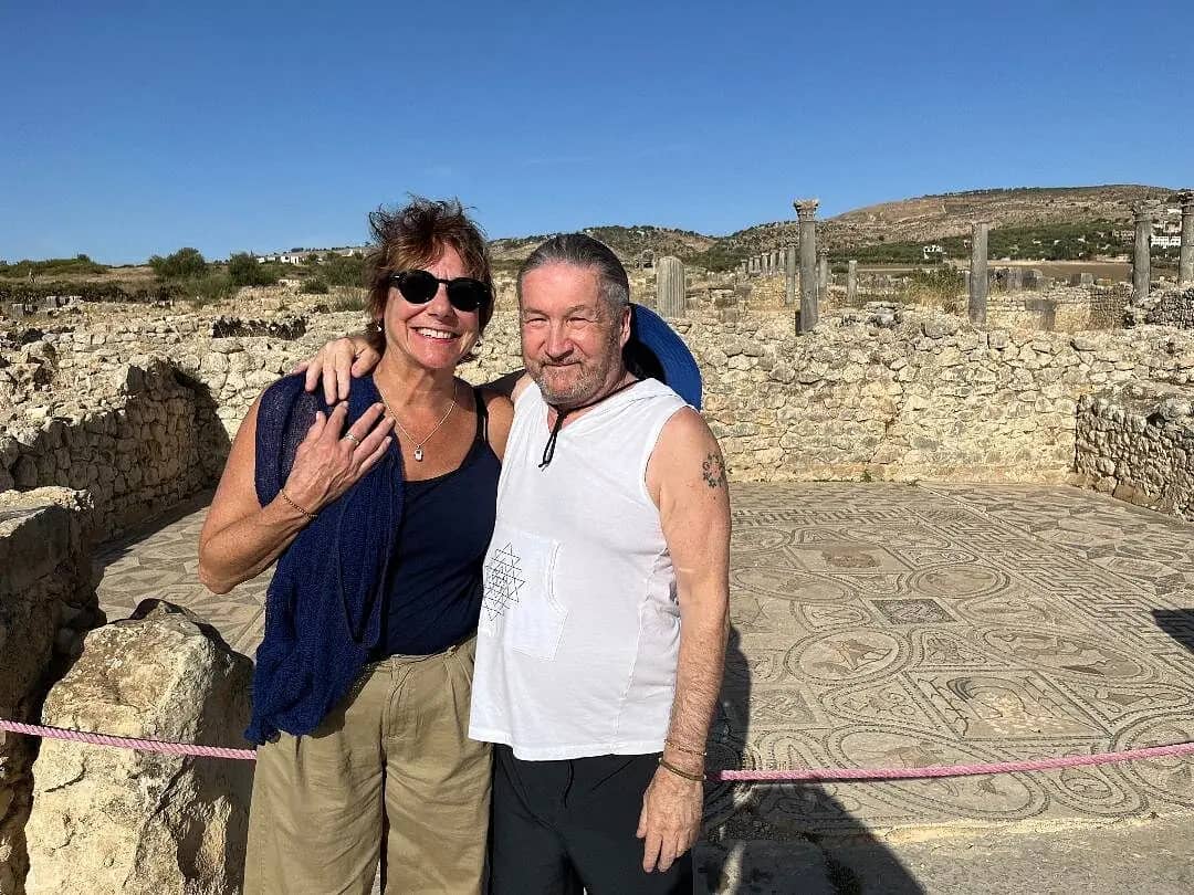 Couple standing by the Roman floor mosaics at Volubilis