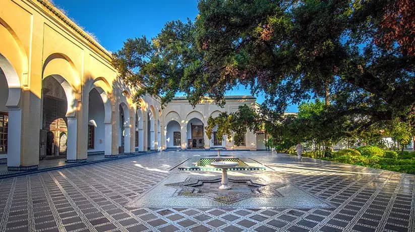 Bahia Palace courtyard in Marrakech — zellige tilework and carved cedar