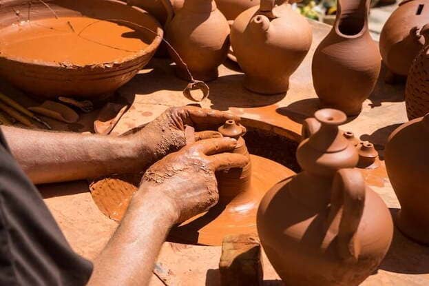 A potter shaping blue Fassi ceramics in Fes, the craft capital of Morocco