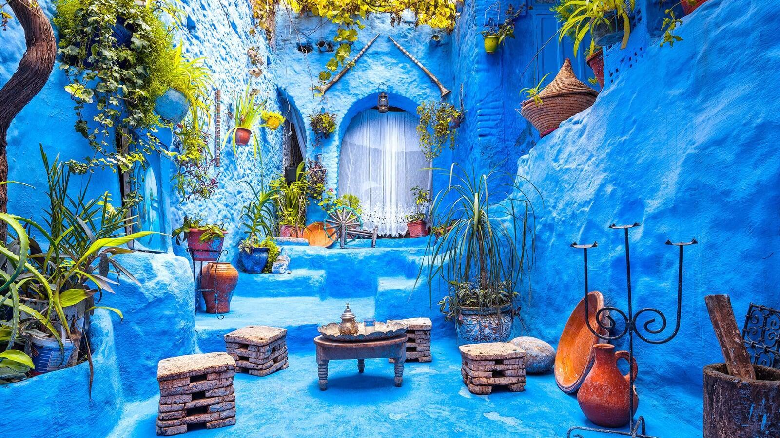 Blue-washed streets and houses of Chefchaouen, Morocco’s ‘Blue City’, with narrow alleys and mountain backdrop featured on our northern Morocco tours