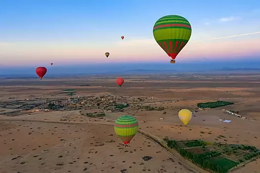 Hot air balloon floating over the Atlas Mountains near Marrakech – luxury Morocco adventure tour experience