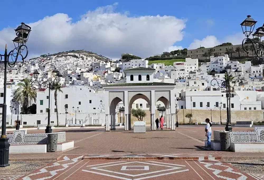 Tetouan Morocco medina street with white buildings and green tiled roofs