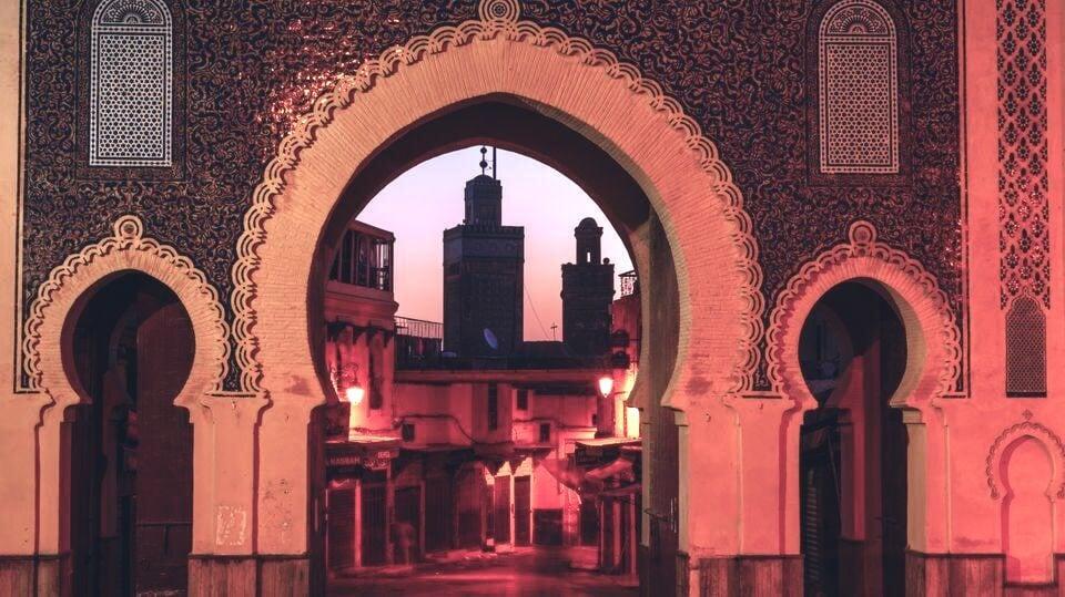The royal palace door is adorned with a fez.